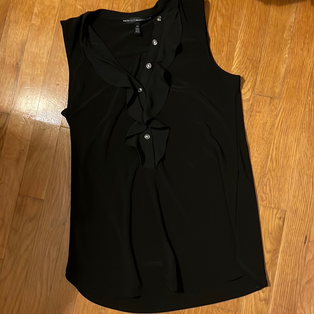 White House Black Market Black ruffle tank with silver buttons.